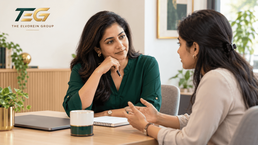 People Management: 7 Key Elements for Effective Leadership 3 People Management image showing a manager listening attentively to a colleague during an office conversation, with the TEG logo.